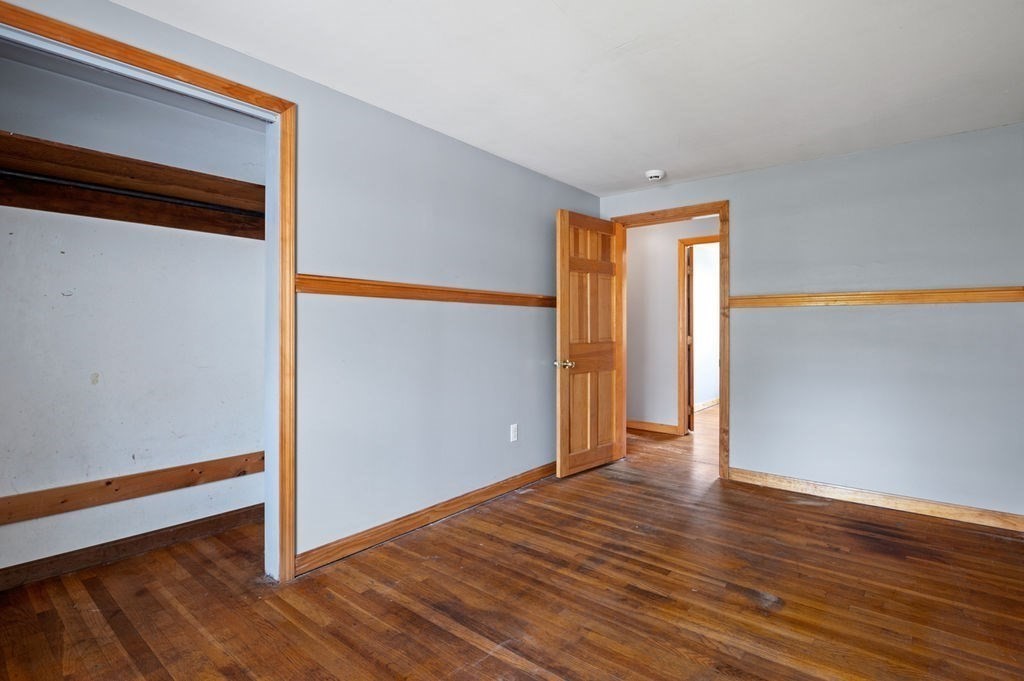 63 Middle Road Amesbury, MA 01913 - Photo 18 of 37 a view of an empty room with wooden floor