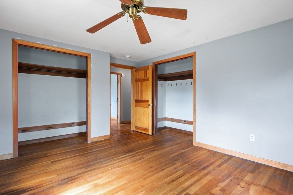 63 Middle Road Amesbury, MA 01913 - Photo 19 of 37 a view of an empty room with wooden floor and a window