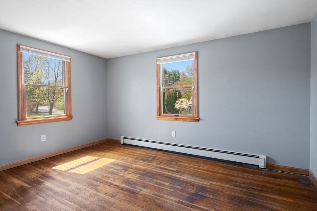 63 Middle Road Amesbury, MA 01913 - Photo 23 of 37 a view of room with window and wooden floor