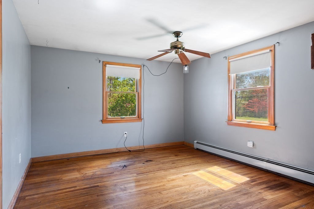 63 Middle Road Amesbury, MA 01913 - Photo 24 of 37 a view of an empty room with wooden floor and a window