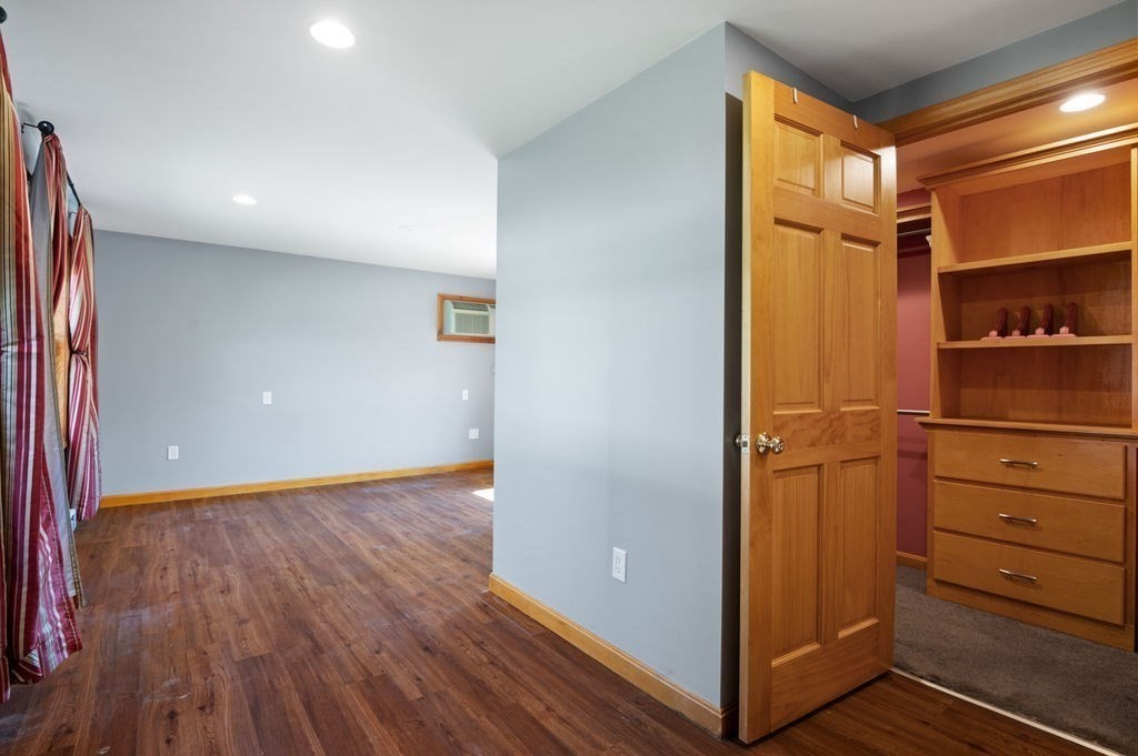 63 Middle Road Amesbury, MA 01913 - Photo 25 of 37 a view of walk in closet with empty racks