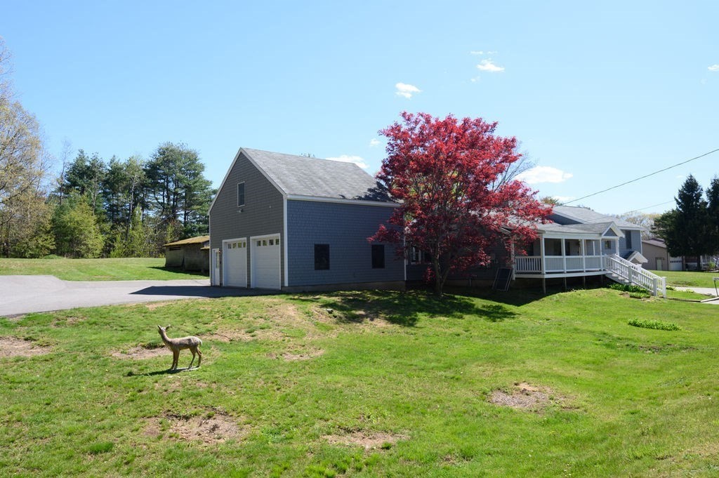 63 Middle Road Amesbury, MA 01913 - Photo 3 of 37 a house view with a sitting space and garden