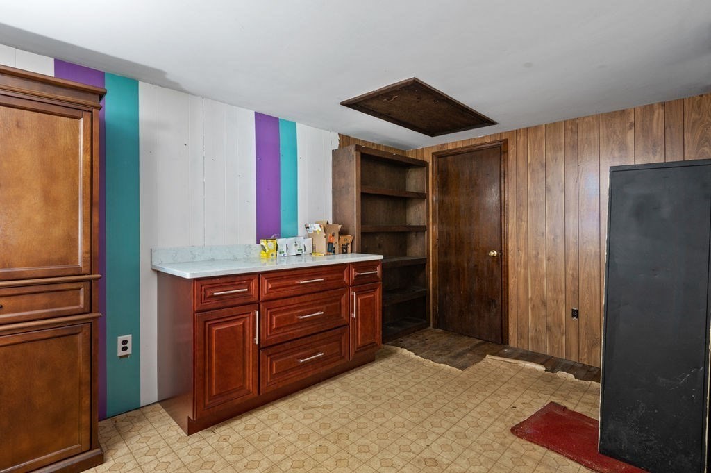63 Middle Road Amesbury, MA 01913 - Photo 31 of 37 a room with a dresser and a mirror