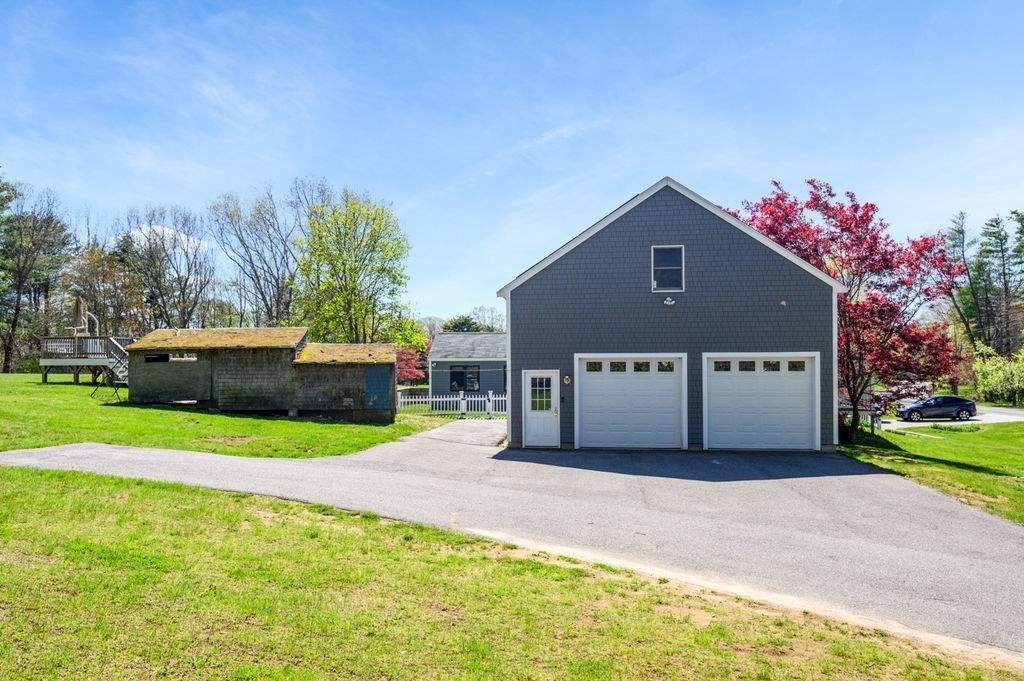 63 Middle Road Amesbury, MA 01913 - Photo 34 of 37 a house with trees in front of it