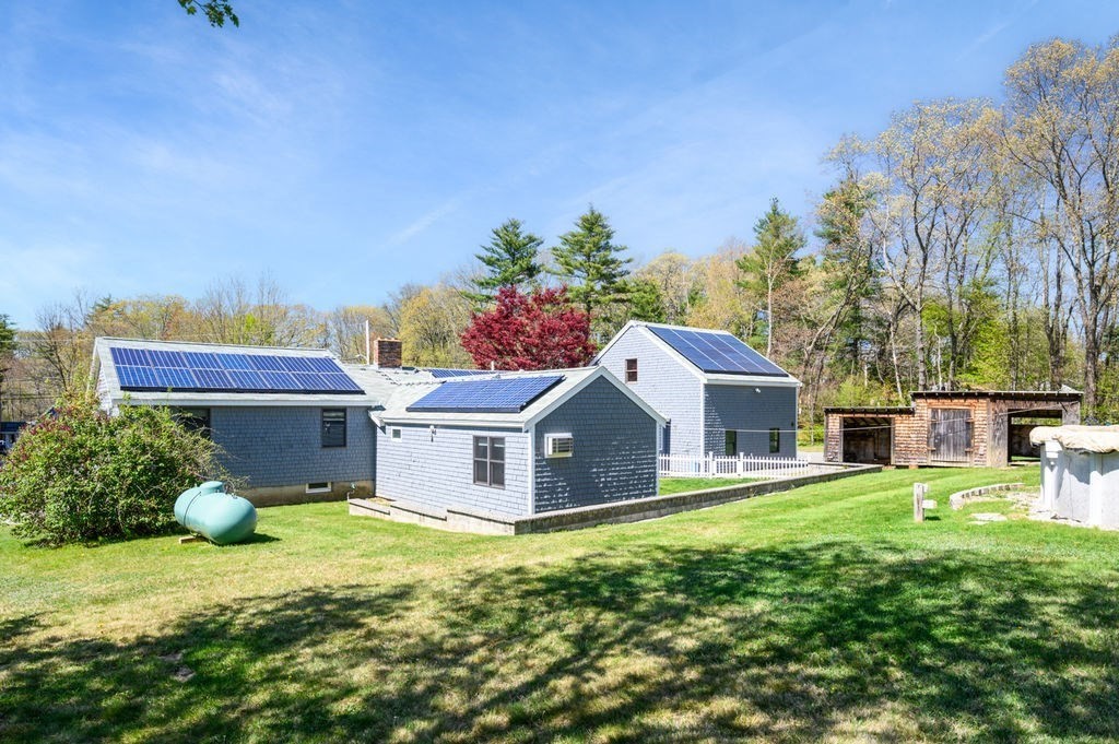 63 Middle Road Amesbury, MA 01913 - Photo 5 of 37 a house view with a sitting space and garden