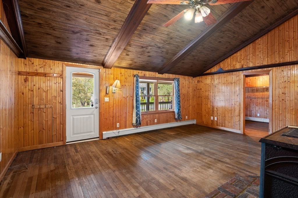 63 Middle Road Amesbury, MA 01913 - Photo 10 of 37 a view of an empty room with wooden floor and a window