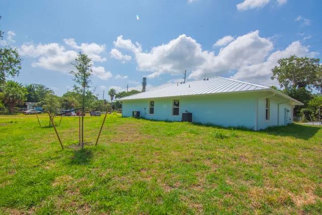 a view of a big yard with a swimming pool