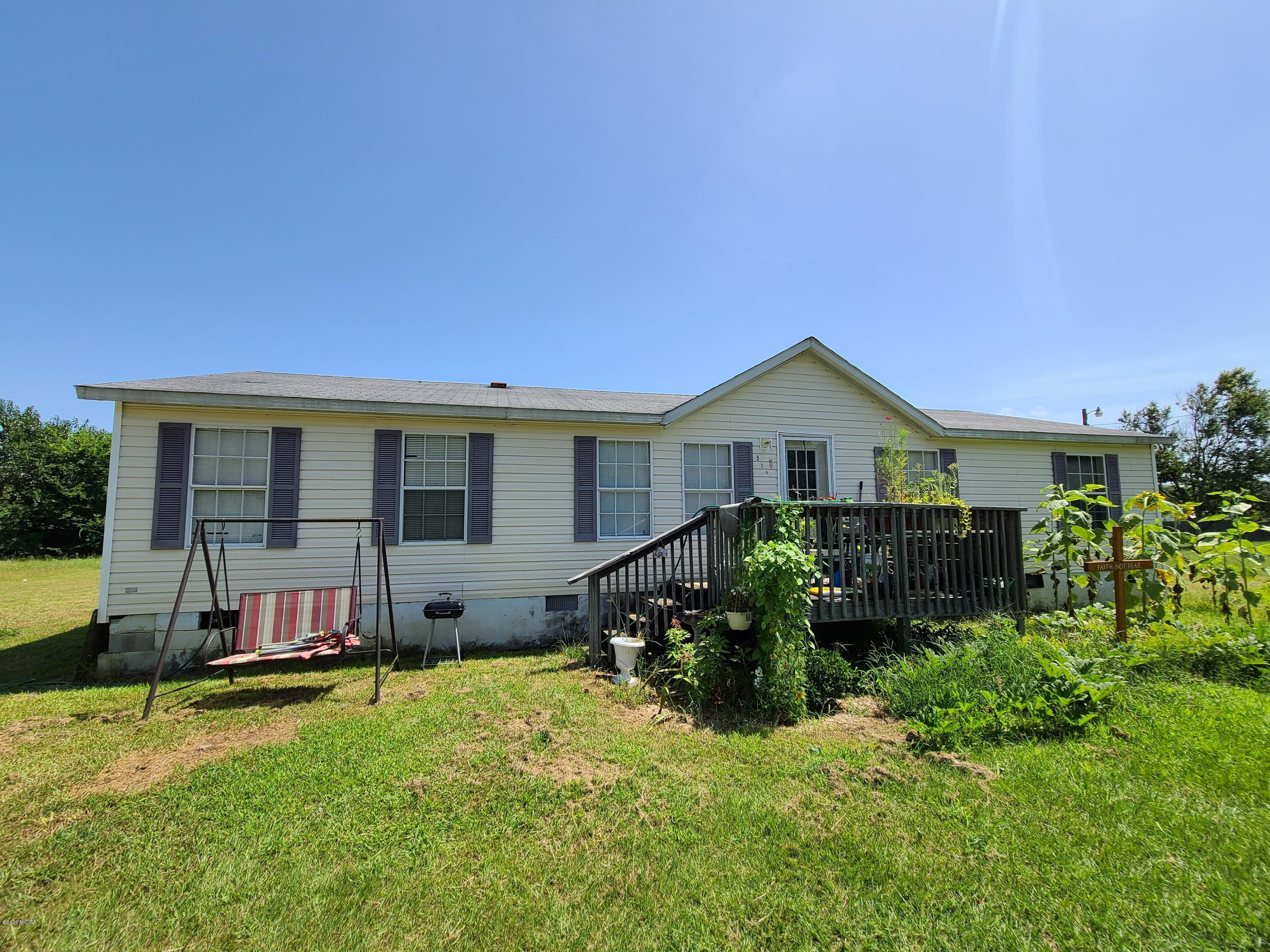 512 Boy Scout Road Byron, GA 31008 - Photo 2 of 12 a house view with a garden space