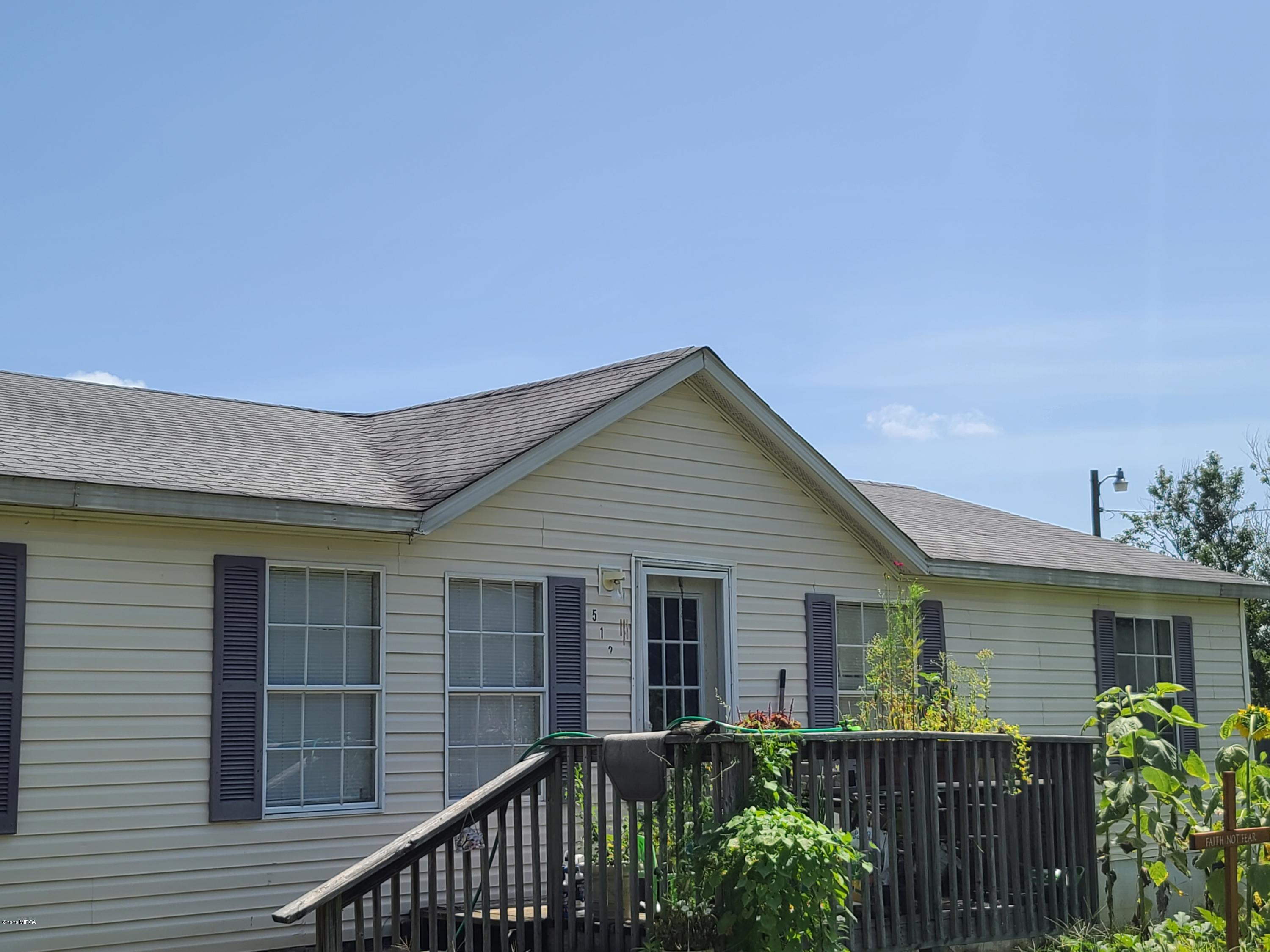 512 Boy Scout Road Byron, GA 31008 - Photo 3 of 12 a view of a house with a yard