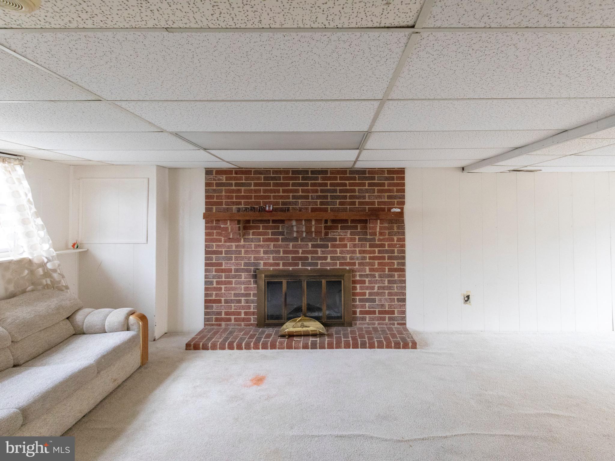 17661 Kohlhoss Road Poolesville, MD 20837 - Photo 19 of 23 Basement w/ Fireplace.