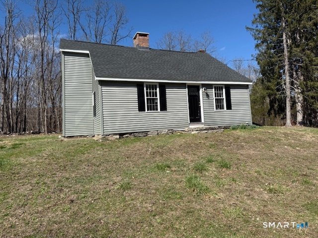 a house with trees in the background