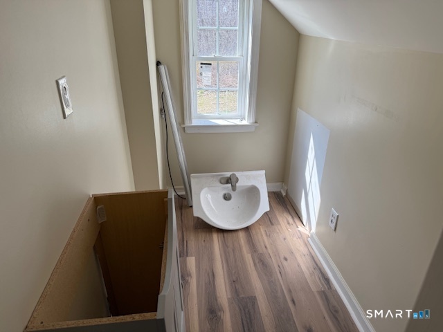 605 Highway 6 Andover, CT 06232 - Photo 13 of 14 a view of a hallway with wooden floor and glass door