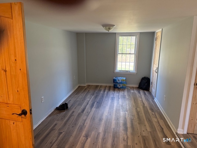 605 Highway 6 Andover, CT 06232 - Photo 9 of 14 wooden floor in an empty room with a window