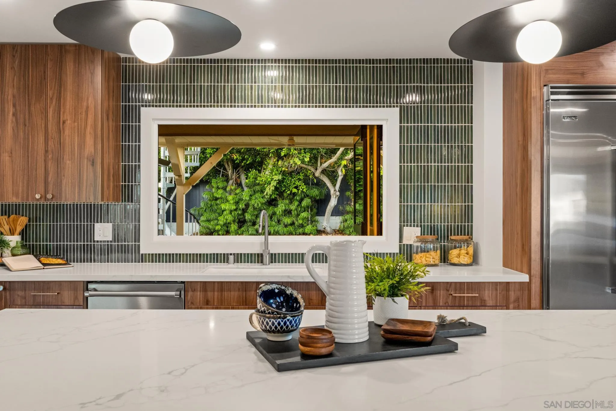 896 La Jolla Rancho Road La Jolla, CA 92037 - Photo 12 of 54 a kitchen with a refrigerator and a large window