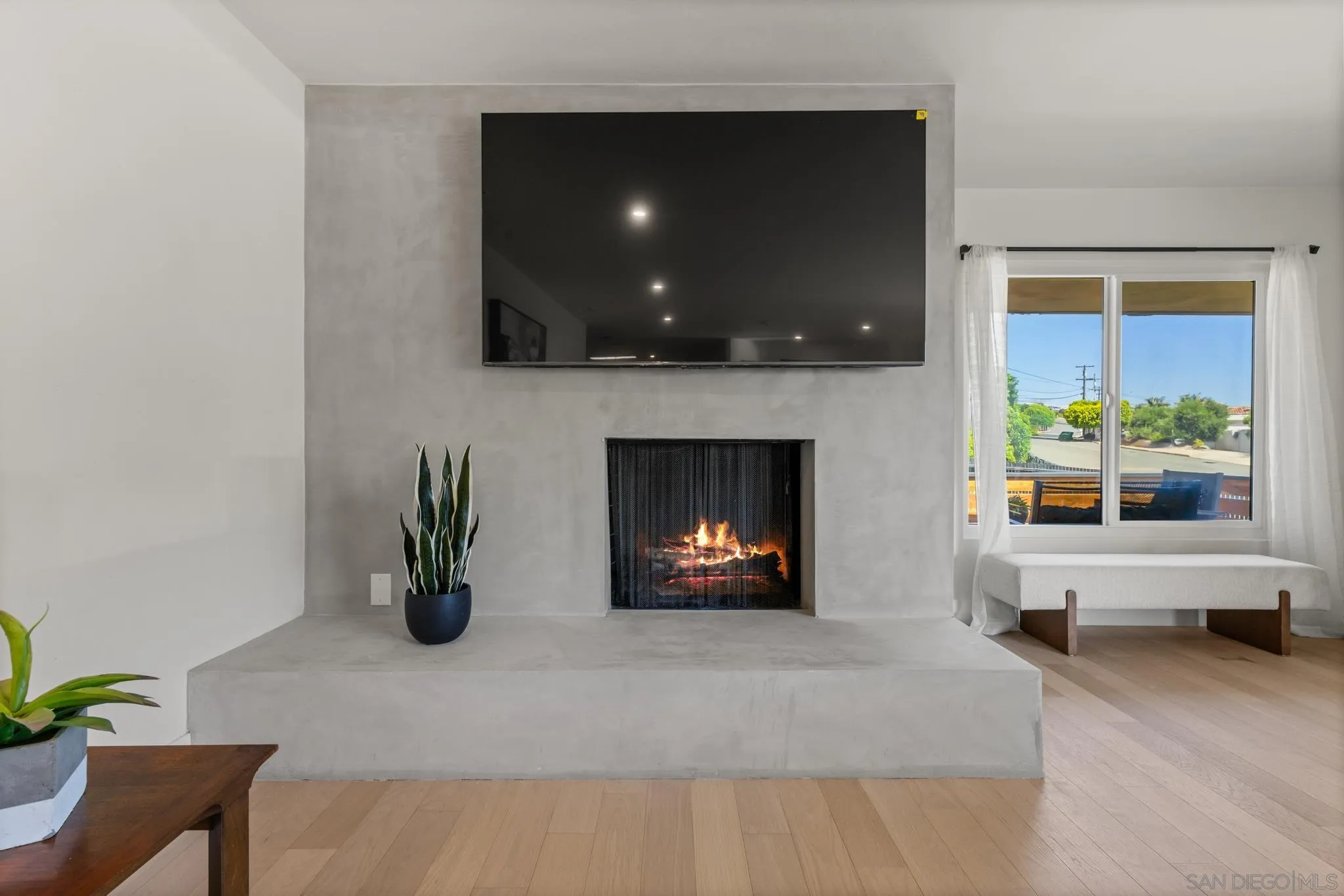 896 La Jolla Rancho Road La Jolla, CA 92037 - Photo 13 of 54 a living room with furniture and a fireplace
