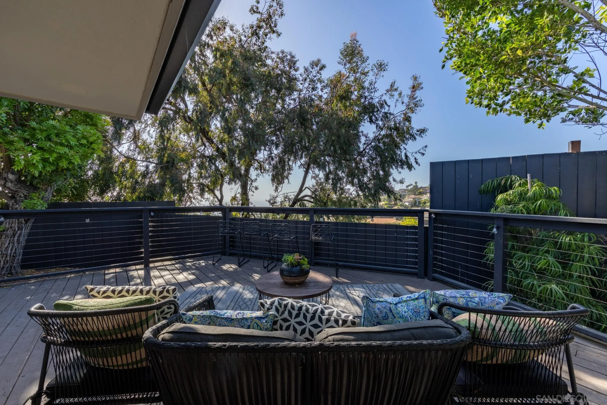 896 La Jolla Rancho Road La Jolla, CA 92037 - Photo 14 of 54 a view of a chairs and tables in the back yard of the house