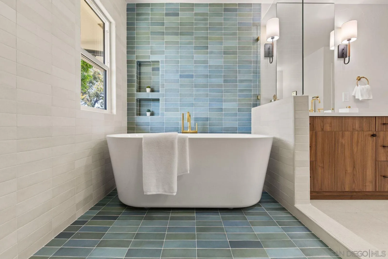 896 La Jolla Rancho Road La Jolla, CA 92037 - Photo 17 of 54 a view of a white tub sitting in a bathroom