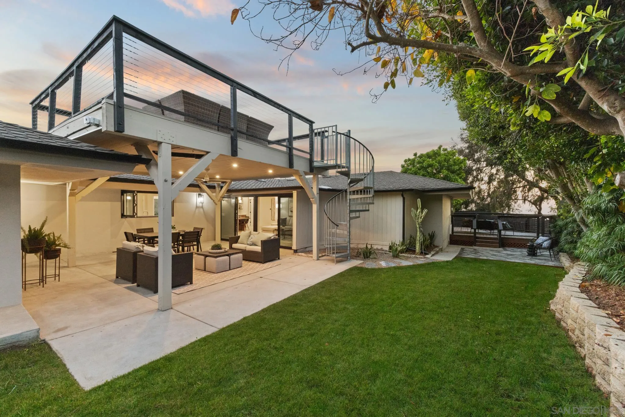 896 La Jolla Rancho Road La Jolla, CA 92037 - Photo 19 of 54 a view of a house with sitting area and garden