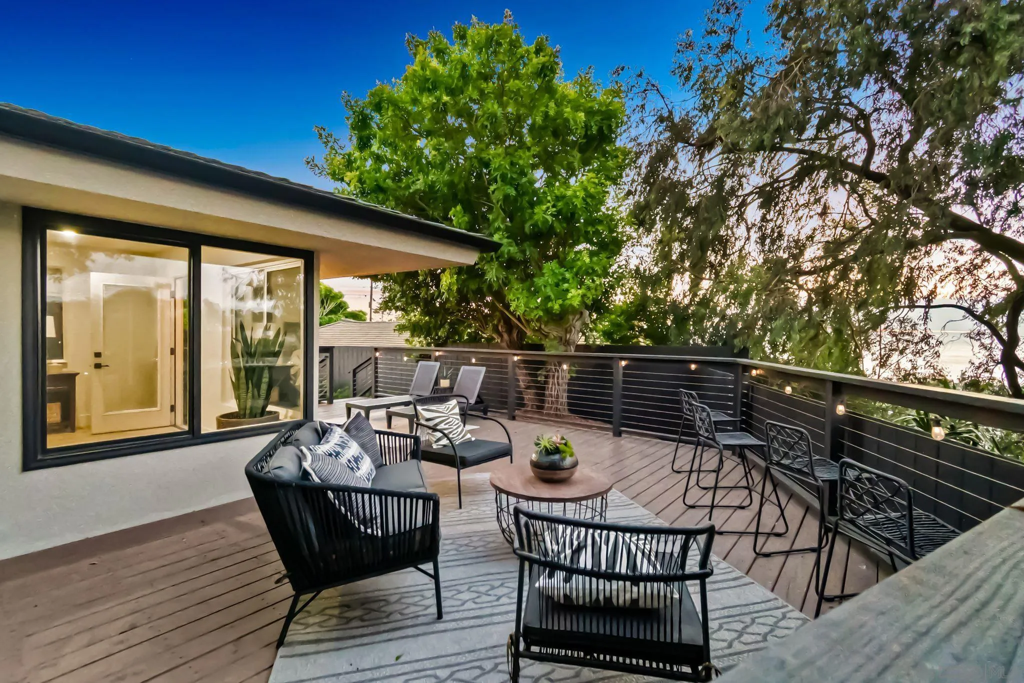 896 La Jolla Rancho Road La Jolla, CA 92037 - Photo 2 of 54 a view of a chairs and table on the deck