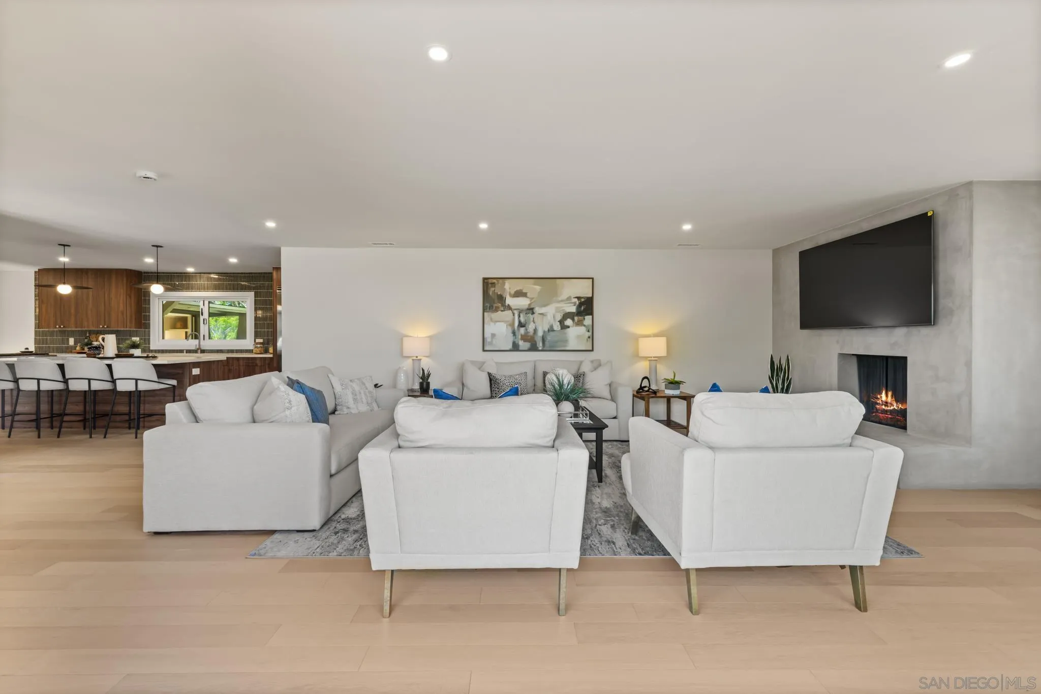 896 La Jolla Rancho Road La Jolla, CA 92037 - Photo 22 of 54 a living room with a couch and a flat screen tv