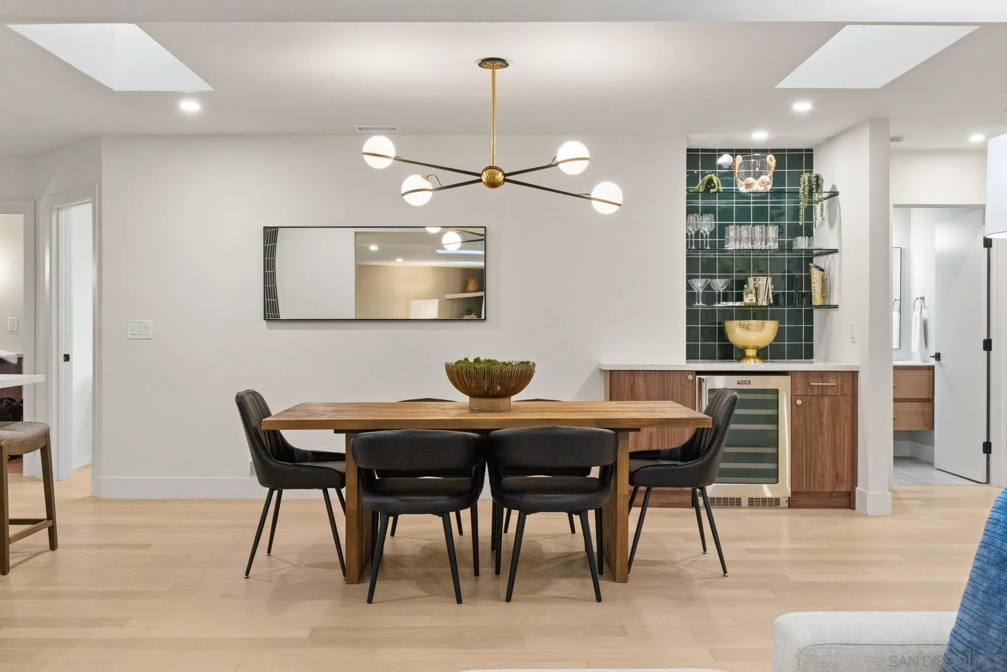 896 La Jolla Rancho Road La Jolla, CA 92037 - Photo 31 of 54 a view of a dining room with furniture and wooden floor