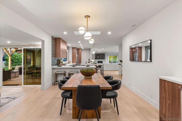 a view of a balcony with couches and wooden floor