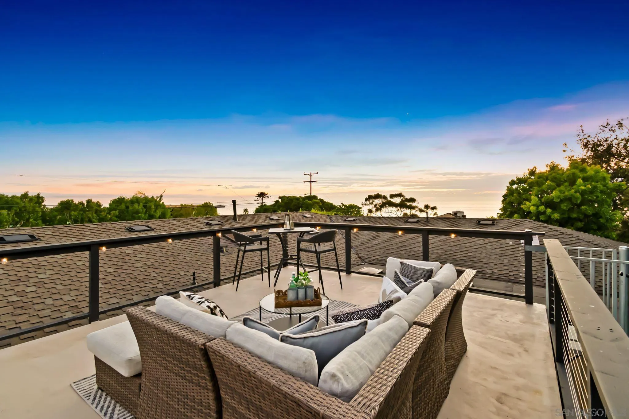 896 La Jolla Rancho Road La Jolla, CA 92037 - Photo 33 of 54 a view of a balcony with couches and wooden floor