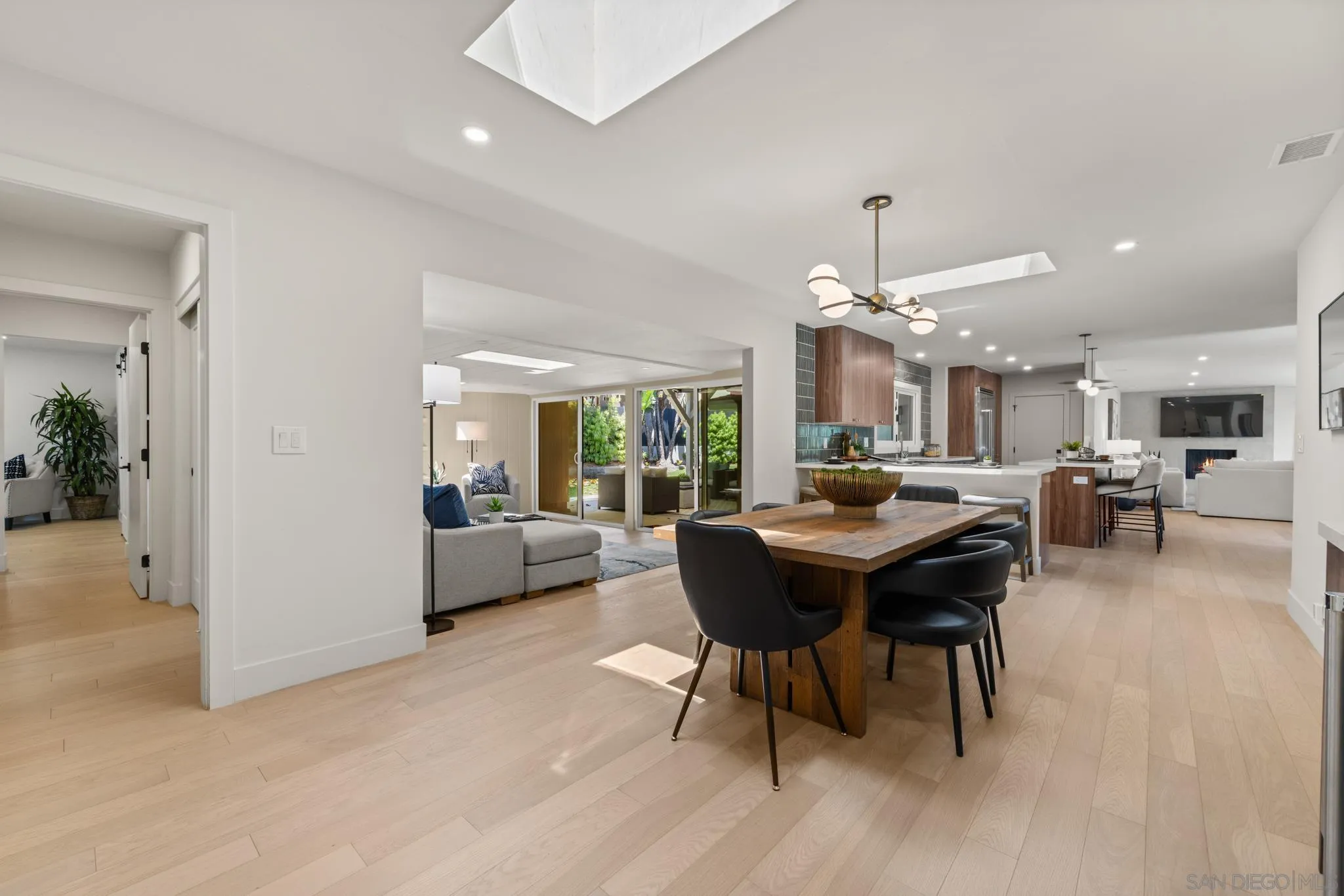 896 La Jolla Rancho Road La Jolla, CA 92037 - Photo 35 of 54 a view of a dining room with furniture window and wooden floor