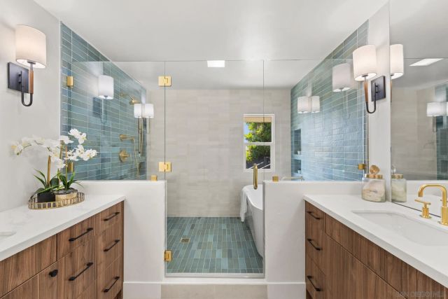 a view of a livingroom with kitchen and furniture