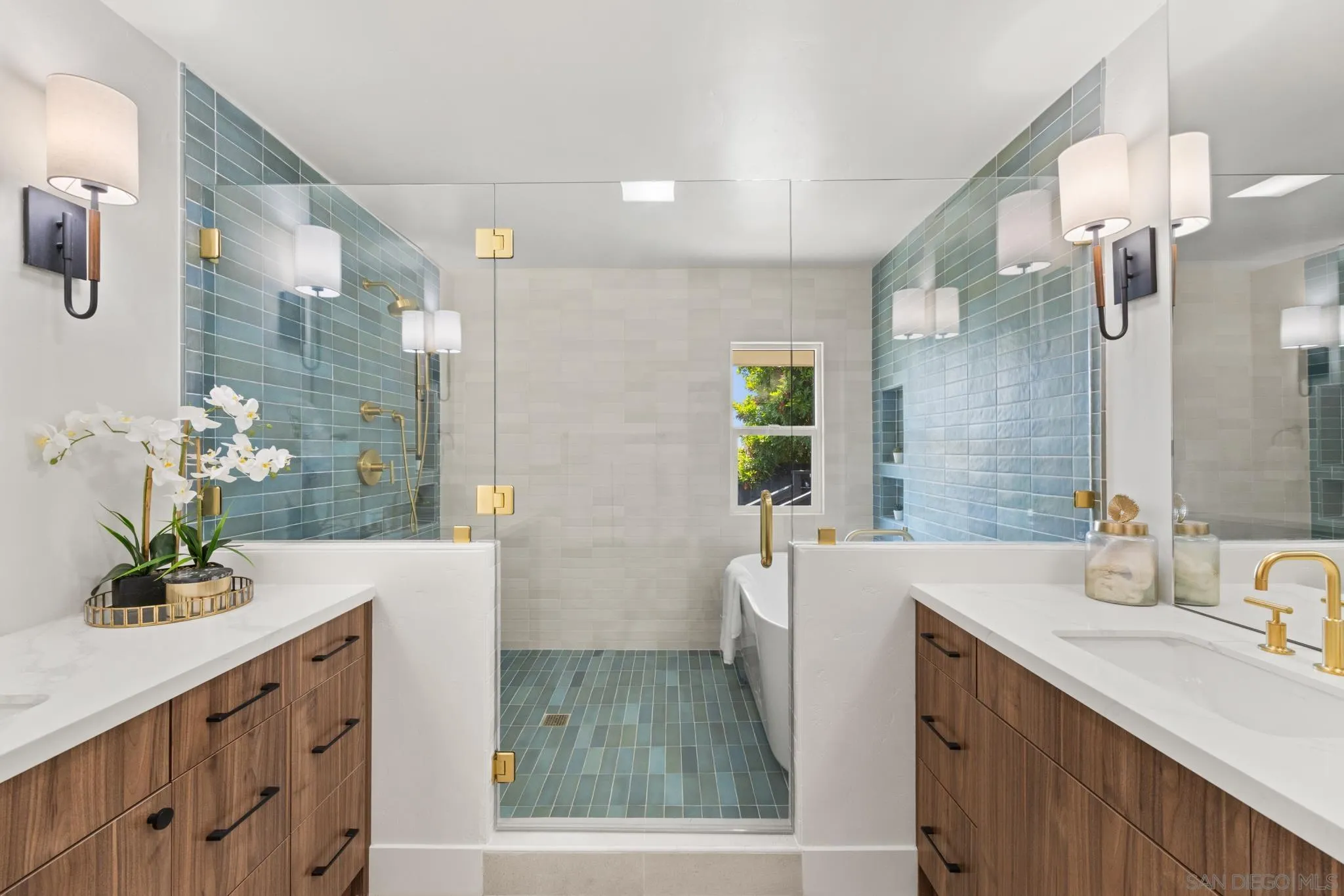 896 La Jolla Rancho Road La Jolla, CA 92037 - Photo 39 of 54 a bathroom with a double vanity sink a mirror a bathtub and shower