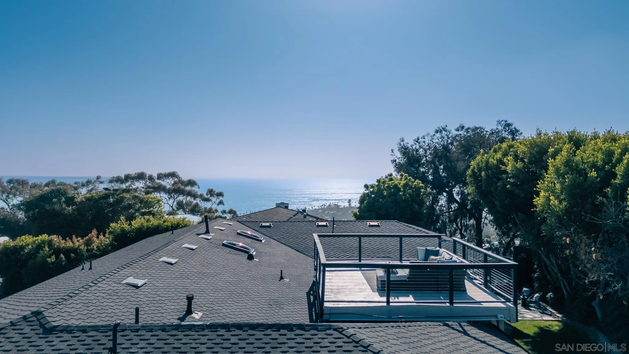 896 La Jolla Rancho Road La Jolla, CA 92037 - Photo 4 of 54 a view of a houses with a yard