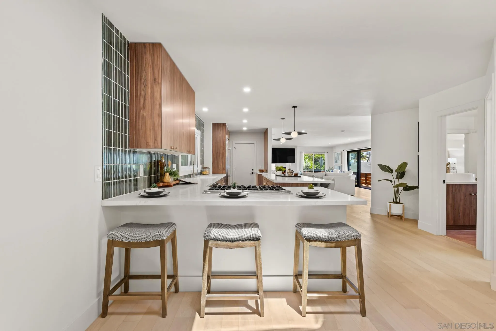 896 La Jolla Rancho Road La Jolla, CA 92037 - Photo 44 of 54 a kitchen with a sink and chairs