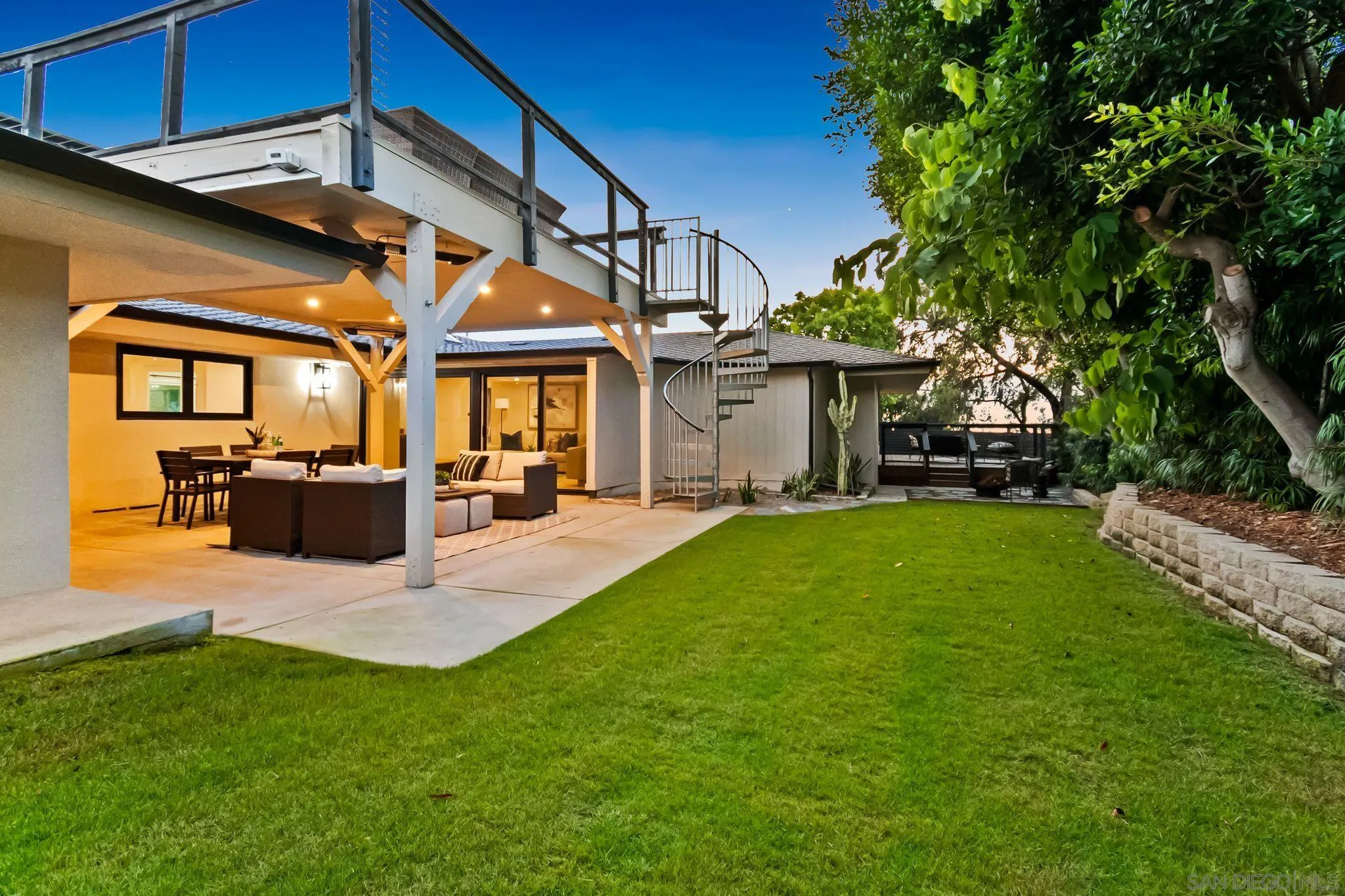 896 La Jolla Rancho Road La Jolla, CA 92037 - Photo 52 of 54 a view of a house with a big yard patio and a yard