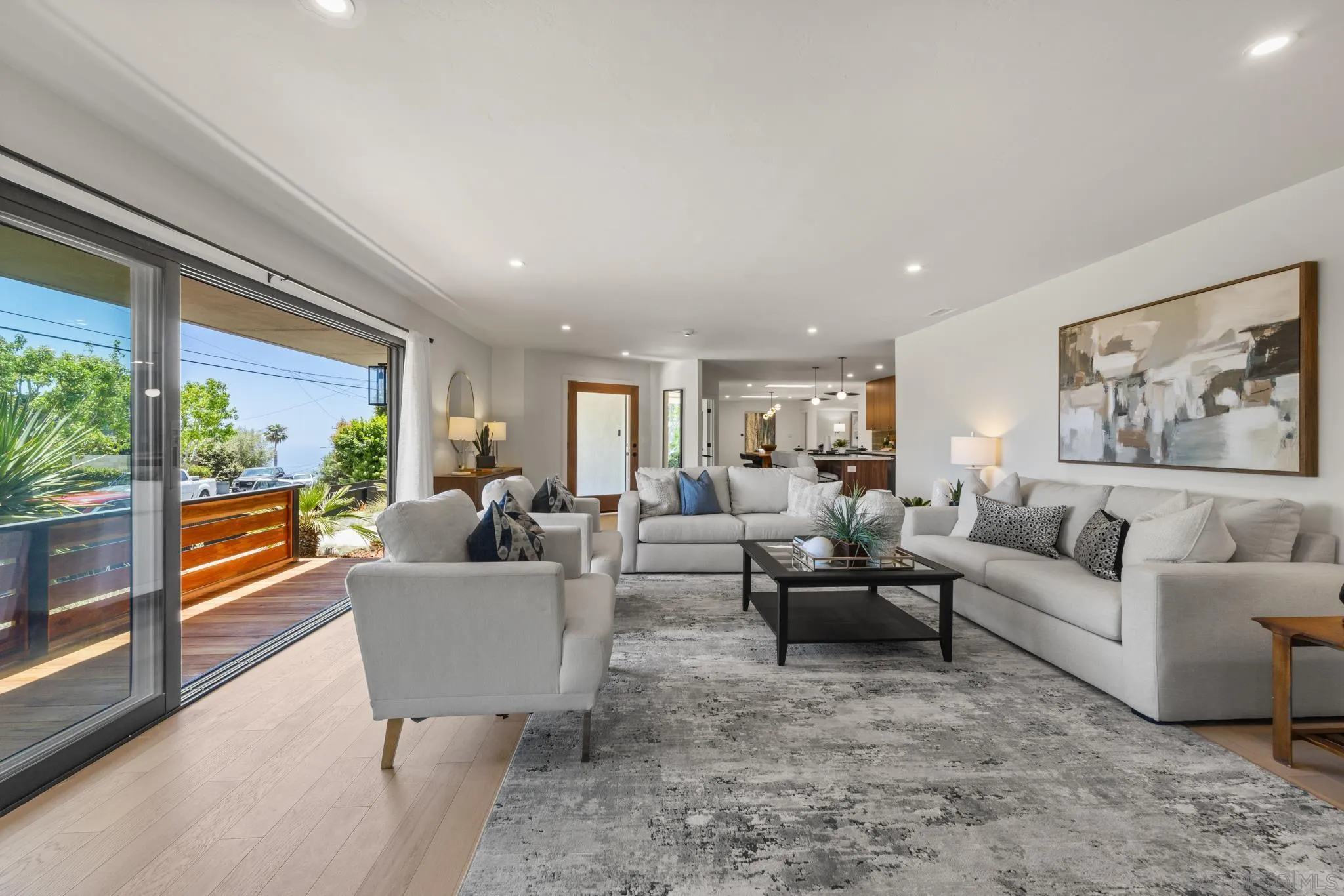896 La Jolla Rancho Road La Jolla, CA 92037 - Photo 10 of 54 a living room with furniture and a large window