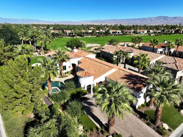 an aerial view of a houses with a lake view