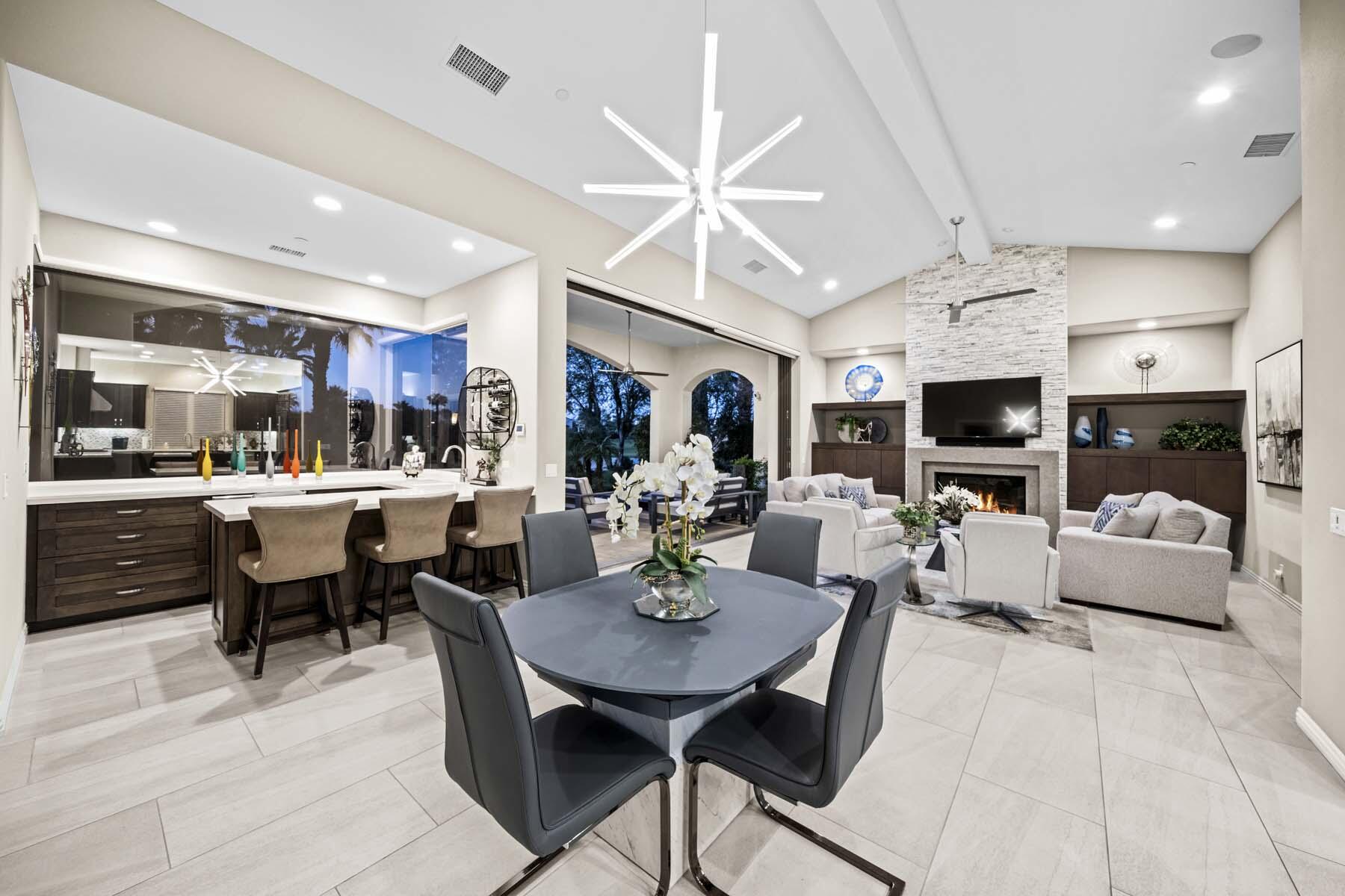 76054 Via Saturnia Indian Wells, CA 92210 - Photo 21 of 61 a view of a dining room with furniture