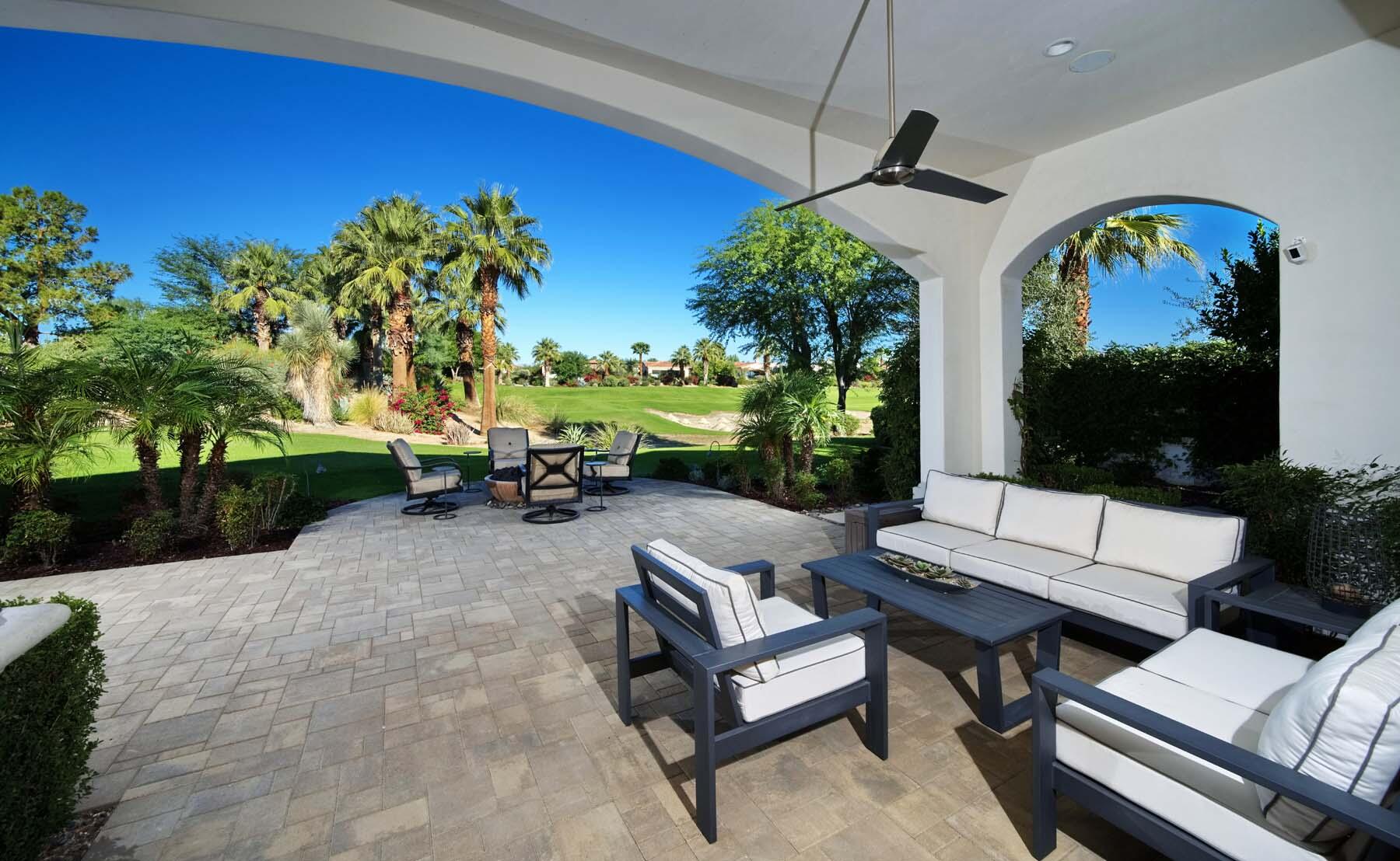 76054 Via Saturnia Indian Wells, CA 92210 - Photo 22 of 61 a living room with patio furniture and a potted plants