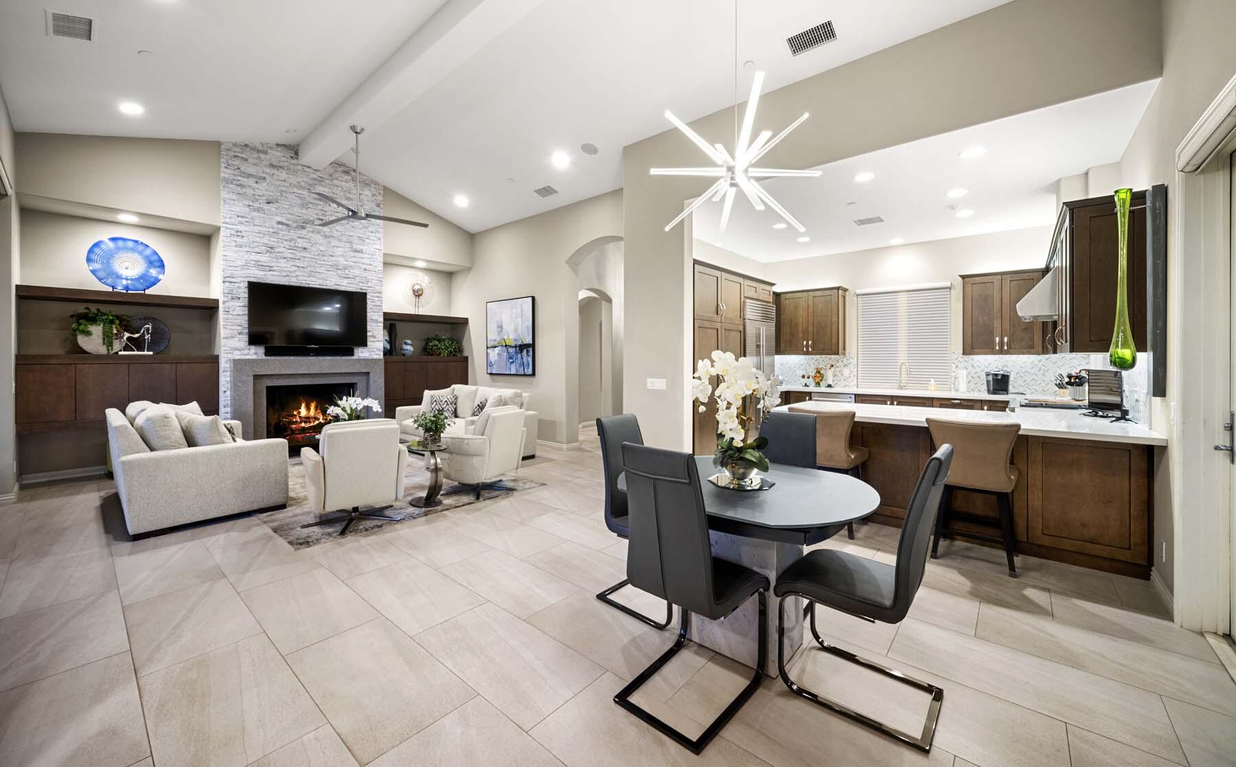 76054 Via Saturnia Indian Wells, CA 92210 - Photo 34 of 61 a living room with fireplace furniture and a flat screen tv