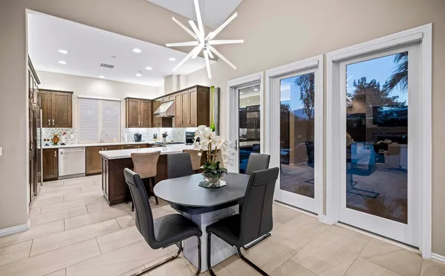 a spacious bathroom with a double vanity sink a mirror a bathtub and shower