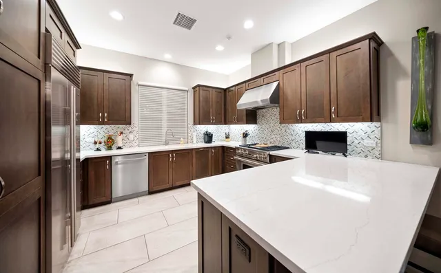 a spacious bathroom with a sink and a mirror