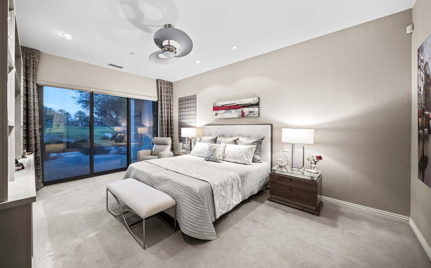 76054 Via Saturnia Indian Wells, CA 92210 - Photo 41 of 61 a spacious bedroom with a bed and a large window