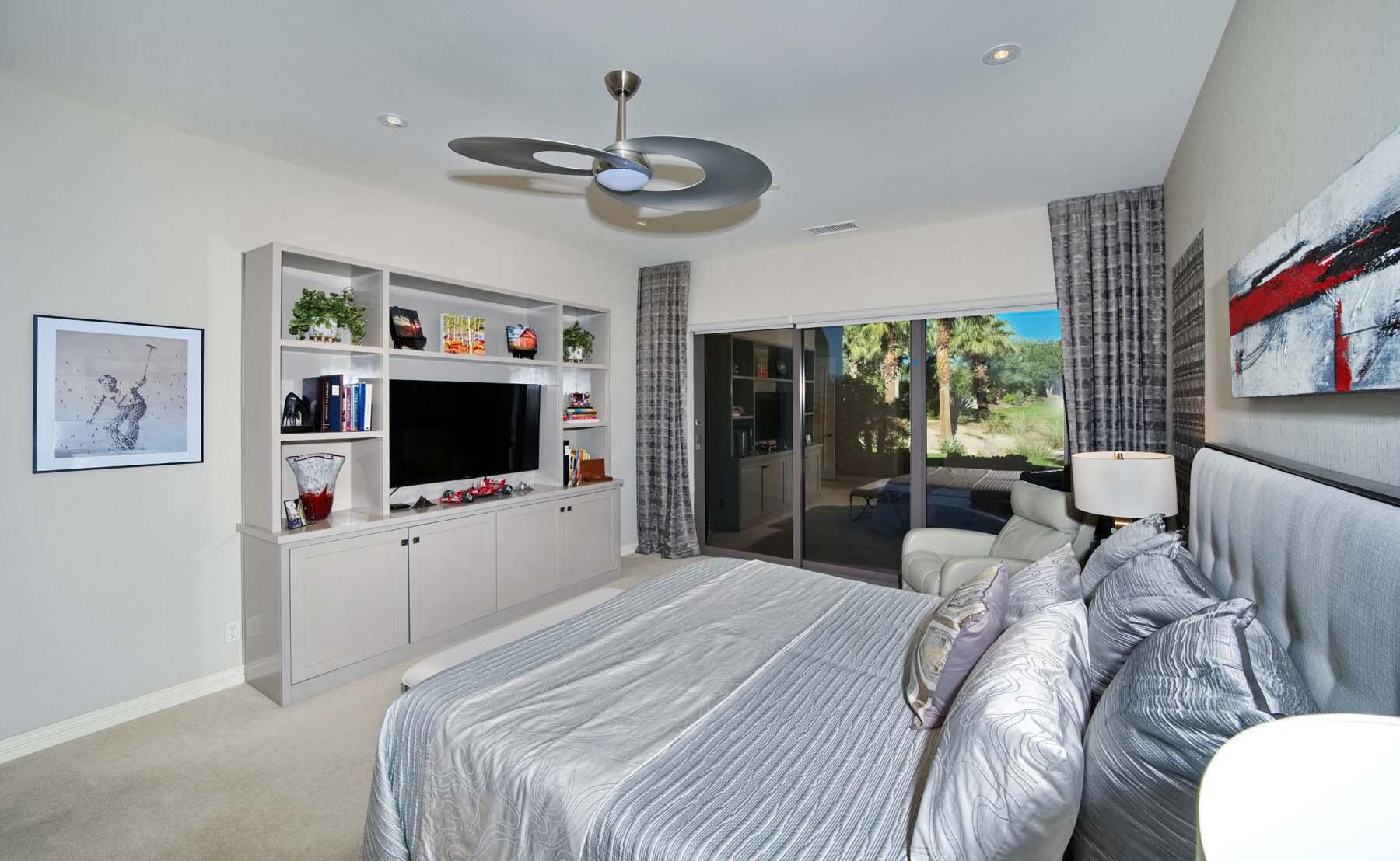 76054 Via Saturnia Indian Wells, CA 92210 - Photo 42 of 61 a bedroom with a bed and a flat screen tv