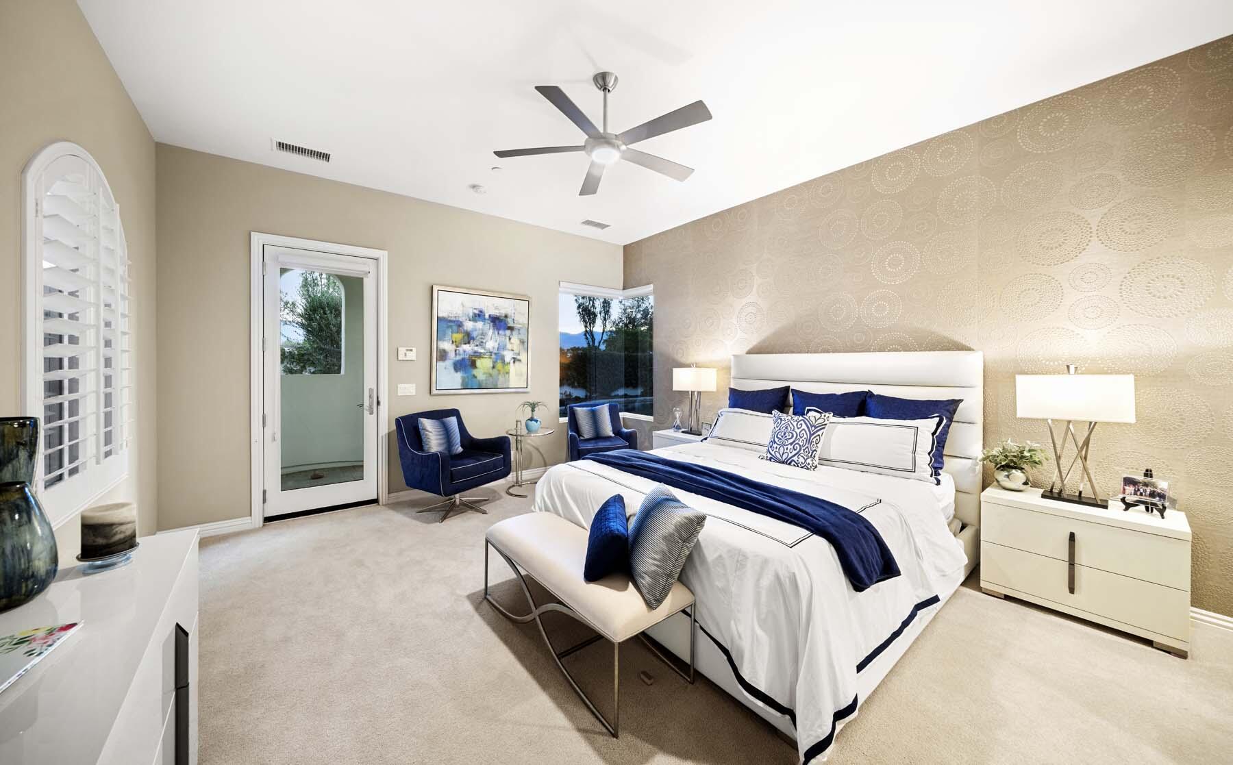 76054 Via Saturnia Indian Wells, CA 92210 - Photo 49 of 61 a spacious bedroom with a bed and ceiling fan