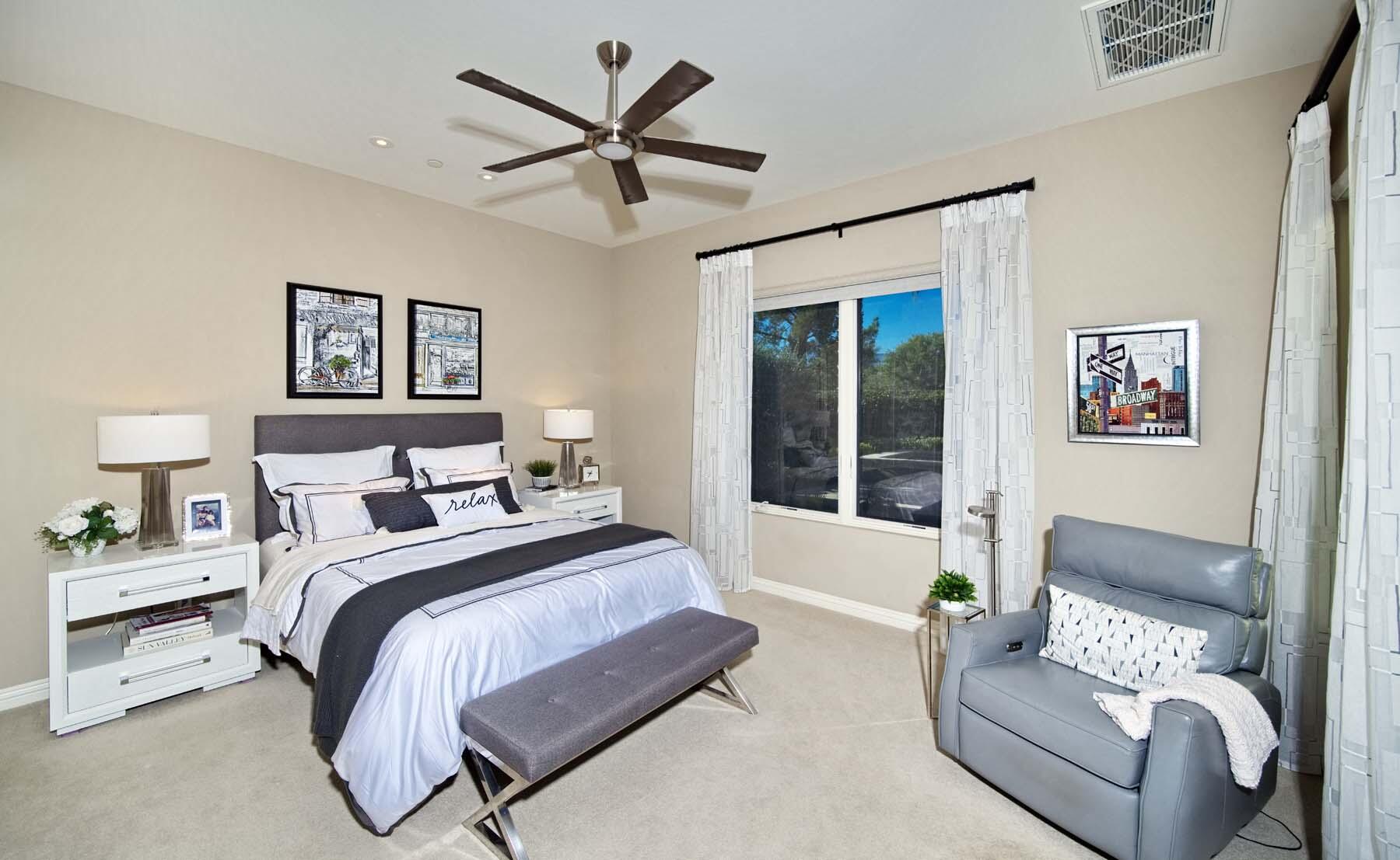 76054 Via Saturnia Indian Wells, CA 92210 - Photo 53 of 61 a spacious bedroom with a bed couch and a window