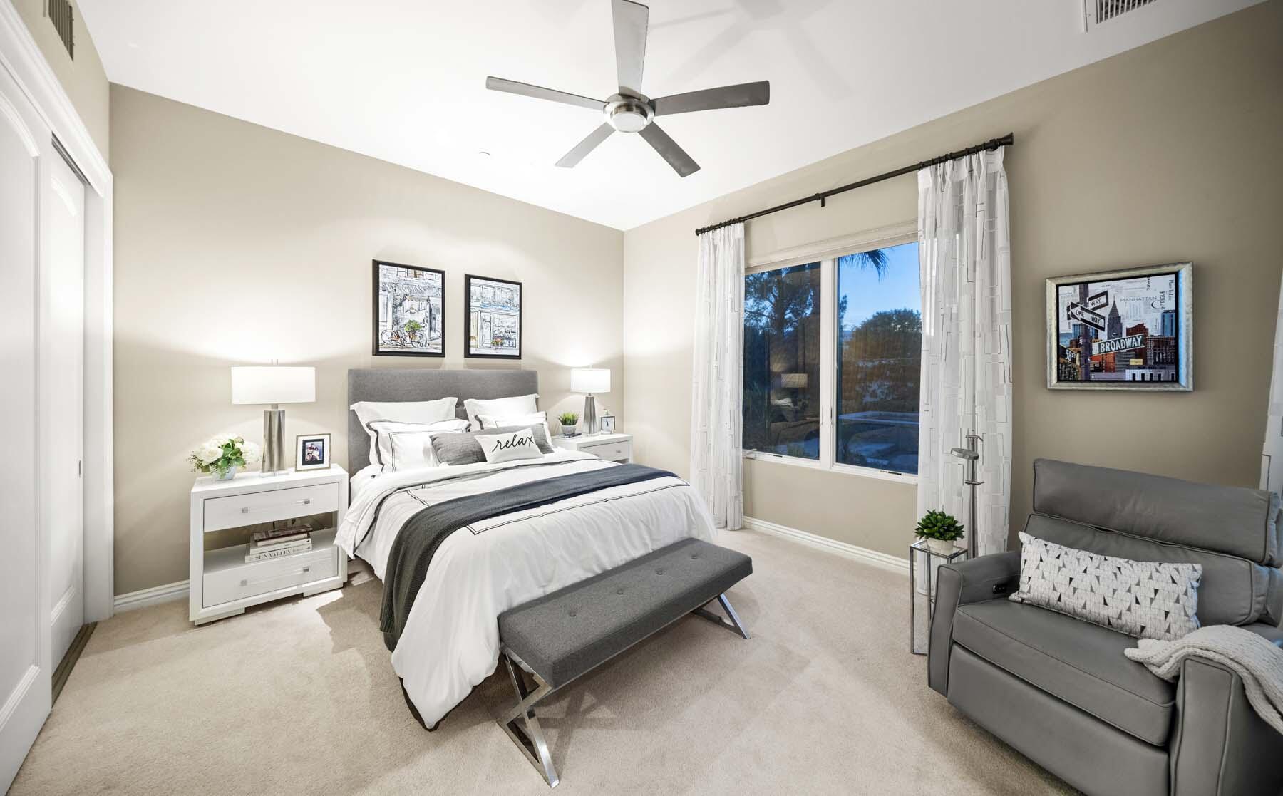 76054 Via Saturnia Indian Wells, CA 92210 - Photo 54 of 61 a spacious bedroom with a bed couch and a window