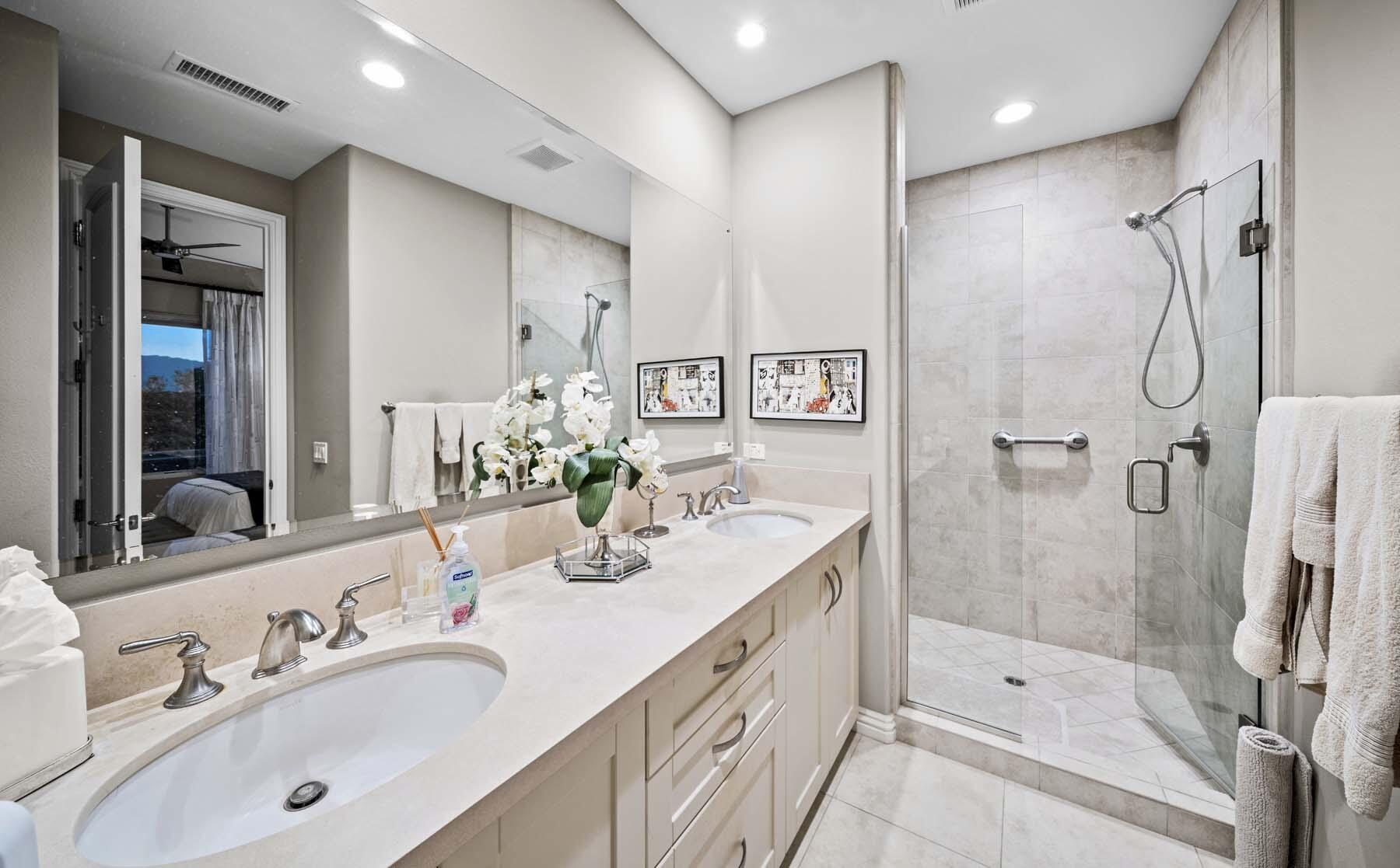 76054 Via Saturnia Indian Wells, CA 92210 - Photo 57 of 61 a bathroom with a tub sink shower and mirror