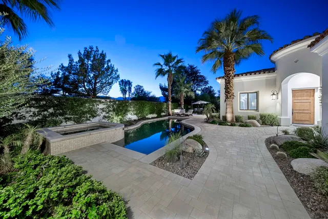 a view of a backyard with a sitting area and furniture