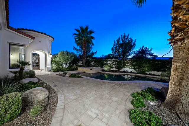 a view of backyard with seating space and trees