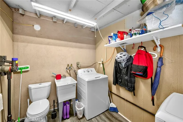 a utility room with a lot of stuff and washer