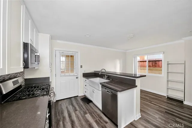 a kitchen with a stove and a sink